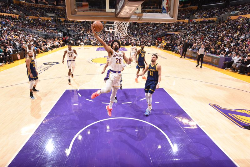 LOS ANGELES, CA - MARCH 16:  Spencer Dinwiddie #26 of the Los Angeles Lakers goes to the basket during the game on March 16, 2024 at Crypto.Com Arena in Los Angeles, California. NOTE TO USER: User expressly acknowledges and agrees that, by downloading and/or using this Photograph, user is consenting to the terms and conditions of the Getty Images License Agreement. Mandatory Copyright Notice: Copyright 2024 NBAE (Photo by Andrew D. Bernstein/NBAE via Getty Images)