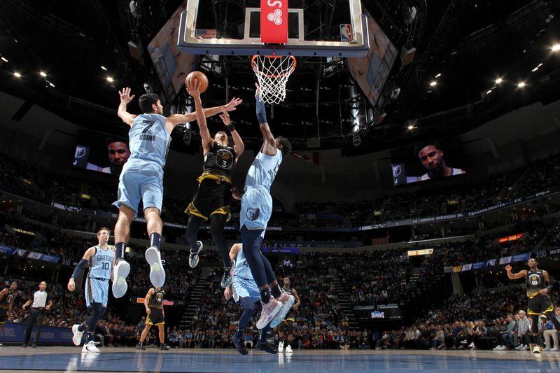 MEMPHIS, TN - MARCH 18: Jordan Poole #3 of the Golden State Warriors drives to the basket during the game against the Memphis Grizzlies on March 18, 2023 at FedExForum in Memphis, Tennessee. NOTE TO USER: User expressly acknowledges and agrees that, by downloading and or using this photograph, User is consenting to the terms and conditions of the Getty Images License Agreement. Mandatory Copyright Notice: Copyright 2023 NBAE (Photo by Joe Murphy/NBAE via Getty Images)