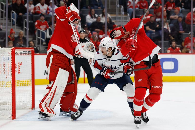 Jan 29, 2026; Detroit, Michigan, USA;  Detroit Red Wings defenseman Albert Johansson (20) blocks a shot in front of goaltender John Gibson (36) and Washington Capitals right wing Brandon Duhaime (22) in the first period at Little Caesars Arena. Mandatory Credit: Rick Osentoski-Imagn Images