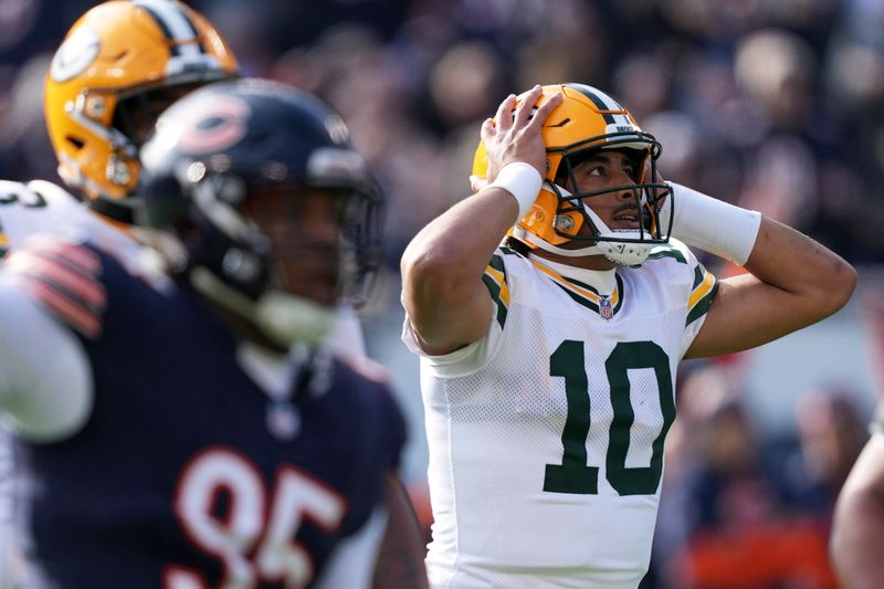 Green Bay Packers' Jordan Love reacts after throwing an interception during the first half of an NFL football game against the Chicago Bears Sunday, Nov. 17, 2024, in Chicago. (AP Photo/Charles Rex Arbogast)