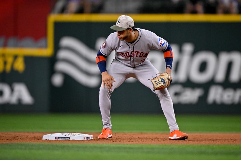 May 16, 2025; Arlington, Texas, USA; Houston Astros shortstop Jeremy Pena (3) looks on as a ball hit by Texas Rangers center fielder Evan Carter (not pictured) gets past him for an error during the second inning at Globe Life Field. Mandatory Credit: Jerome Miron-Imagn Images