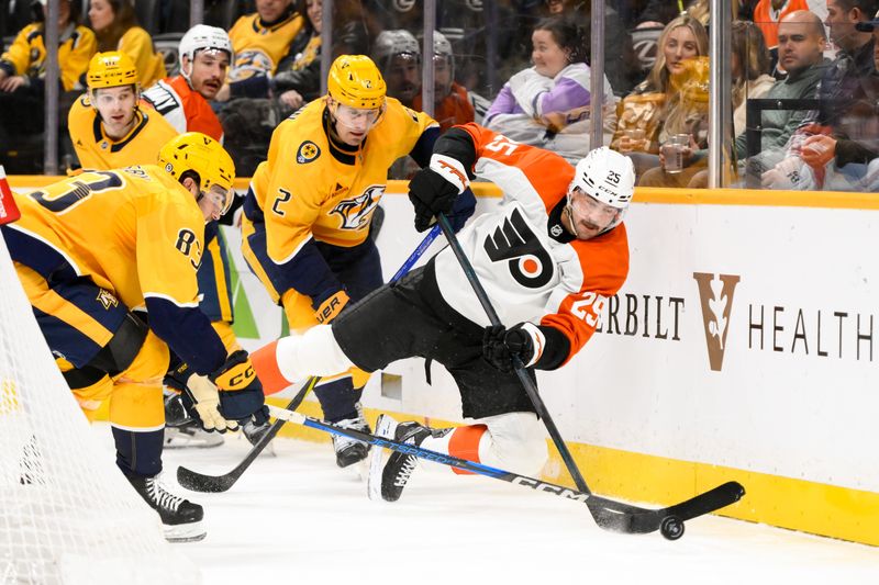 Nov 27, 2024; Nashville, Tennessee, USA;  Philadelphia Flyers center Ryan Poehling (25) clears the puck from behind the net against the Nashville Predators during the second period at Bridgestone Arena. Mandatory Credit: Steve Roberts-Imagn Images