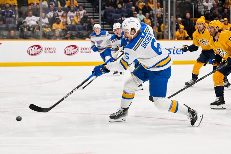Feb 2, 2026; Nashville, Tennessee, USA;  St. Louis Blues defenseman Philip Broberg (6) takes a shot on goal against the Nashville Predators during the first period at Bridgestone Arena. Mandatory Credit: Steve Roberts-Imagn Images