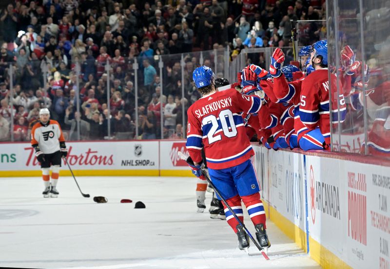 Apr 9, 2024; Montreal, Quebec, CAN; Montreal Canadiens forward Juraj Slafkovsky (20) celebrates with teammates after scoring a goal for a hat trick during the second  period at the Bell Centre. Mandatory Credit: Eric Bolte-USA TODAY Sports