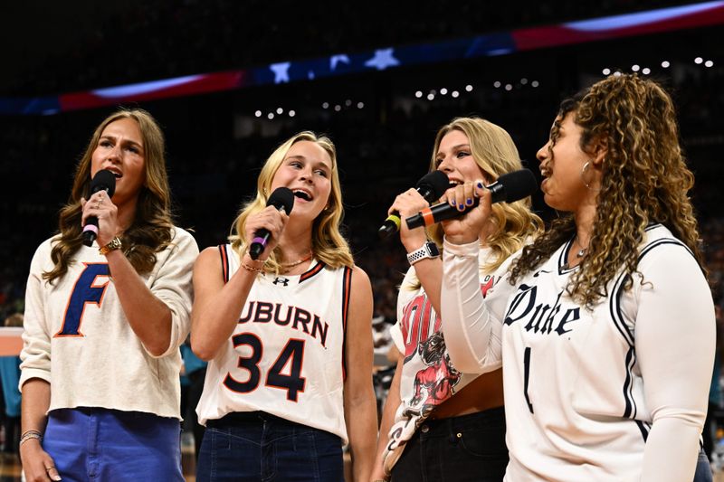 Apr 5, 2025; San Antonio, TX, USA;  National anthem singers representing the Final Four teams perform before the semifinals of the men's Final Four of the 2025 NCAA Tournament at the Alamodome. Mandatory Credit: Brett Wilhelm/Pool Photo via Imagn Images
