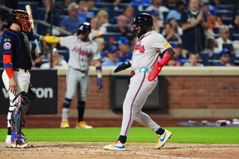 Jul 25, 2024; New York City, New York, USA;  Atlanta Braves designated hitter Marcell Ozuna (20) scores a run on Atlanta Braves catcher Travis d'Arnaud (not pictured) RBI single during the sixth inning at Citi Field. Mandatory Credit: Gregory Fisher-USA TODAY Sports