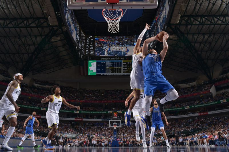 DALLAS, TX - OCTOBER 28: Luka Doncic #77 of the Dallas Mavericks drives to the basket during the game against the Utah Jazz on October 28, 2024 at American Airlines Center in Dallas, Texas. NOTE TO USER: User expressly acknowledges and agrees that, by downloading and or using this photograph, User is consenting to the terms and conditions of the Getty Images License Agreement. Mandatory Copyright Notice: Copyright 2024 NBAE (Photo by Glenn James/NBAE via Getty Images)