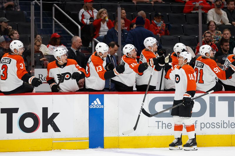 Sep 22, 2024; Washington, District of Columbia, USA; Philadelphia Flyers forward Bobby Brink (10) celebrates with teammates after scoring a goal against the Washington Capitals in the first period at Capital One Arena. Mandatory Credit: Geoff Burke-Imagn Images