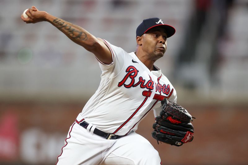 Aug 16, 2023; Atlanta, Georgia, USA; Atlanta Braves relief pitcher Raisel Iglesias (26) throws against the New York Yankees in the ninth inning at Truist Park. Mandatory Credit: Brett Davis-USA TODAY Sports
