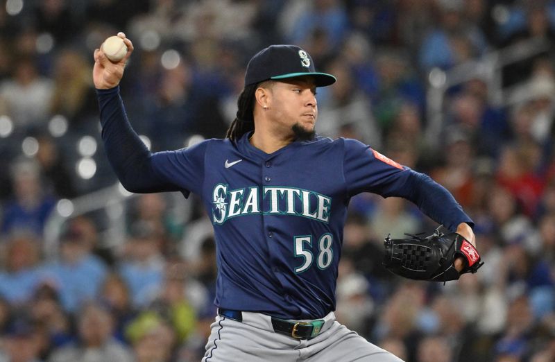 Apr 20, 2025; Toronto, Ontario, CAN;  Seattle Mariners starting pitcher Luis Castillo (58) delivers a pitch against the Toronto Blue Jays in the first inning at Rogers Centre. Mandatory Credit: Dan Hamilton-Imagn Images