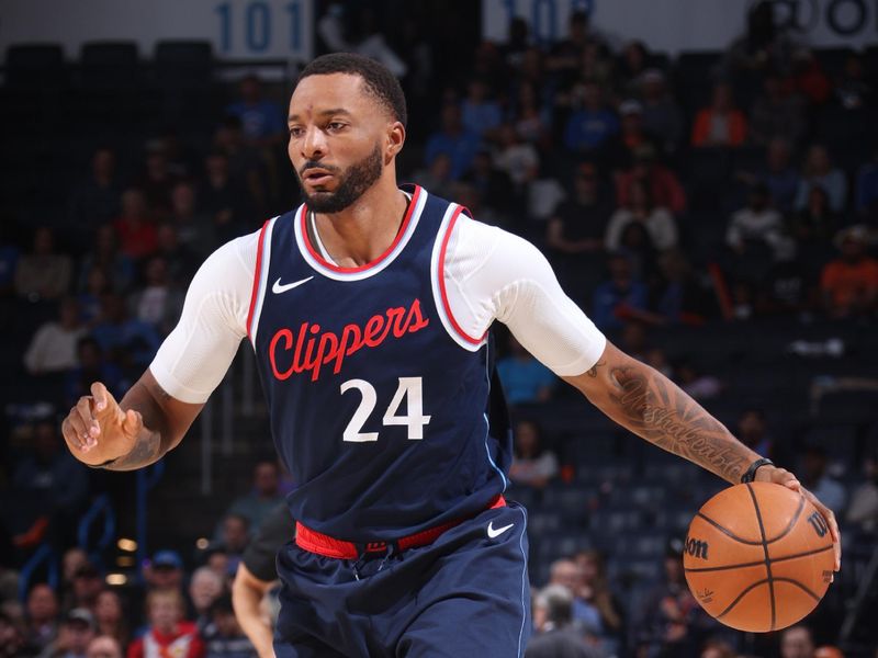 OKLAHOMA CITY, OK - NOVEMBER 11: Norman Powell #24 of the LA Clippers dribbles the ball during the game against the Oklahoma City Thunder on November 11, 2024 at Paycom Center in Oklahoma City, Oklahoma. NOTE TO USER: User expressly acknowledges and agrees that, by downloading and or using this photograph, User is consenting to the terms and conditions of the Getty Images License Agreement. Mandatory Copyright Notice: Copyright 2024 NBAE (Photo by Nathaniel S. Butler/NBAE via Getty Images)