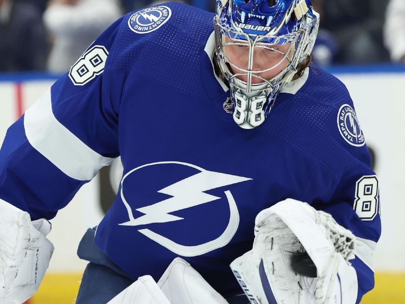 Jan 27, 2024; Tampa, Florida, USA; Tampa Bay Lightning goaltender Andrei Vasilevskiy (88) warms up prior to the game against the New Jersey Devils at Amalie Arena. Mandatory Credit: Kim Klement Neitzel-USA TODAY Sports