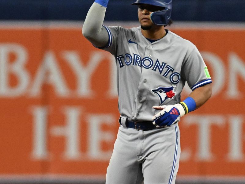 Sep 22, 2023; St. Petersburg, Florida, USA; Toronto Blue Jays second baseman Santiago Espinal (5) celebrates after hitting a double in the ninth inning against the Tampa Bay Rays at Tropicana Field. Mandatory Credit: Jonathan Dyer-USA TODAY Sports