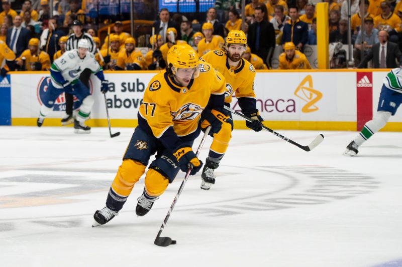 May 3, 2024; Nashville, Tennessee, USA; Nashville Predators right wing Luke Evangelista (77) skates with the puck against the Vancouver Canucks during the first period in game six of the first round of the 2024 Stanley Cup Playoffs at Bridgestone Arena. Mandatory Credit: Steve Roberts-USA TODAY Sports