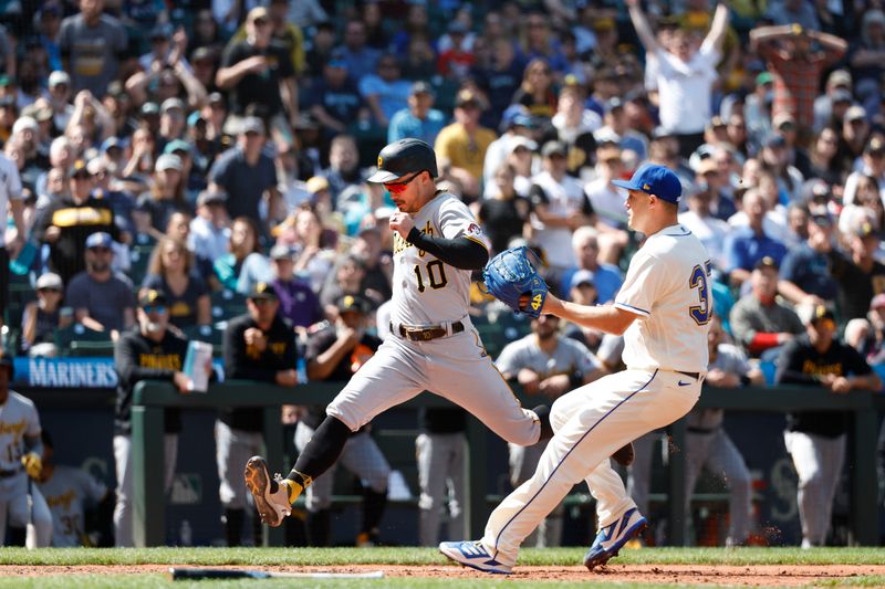 May 28, 2023; Seattle, Washington, USA; Pittsburgh Pirates designated hitter Bryan Reynolds (10) scores a run on a wild pitch by Seattle Mariners relief pitcher Paul Sewald (37) during the eighth inning at T-Mobile Park. Mandatory Credit: Joe Nicholson-USA TODAY Sports