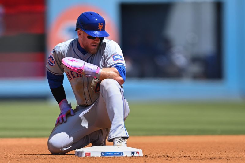 Apr 21, 2024; Los Angeles, California, USA; New York Mets outfielder Harrison Bader (44) out at second base against the Los Angeles Dodgers during the third inning at Dodger Stadium. Mandatory Credit: Jonathan Hui-USA TODAY Sports