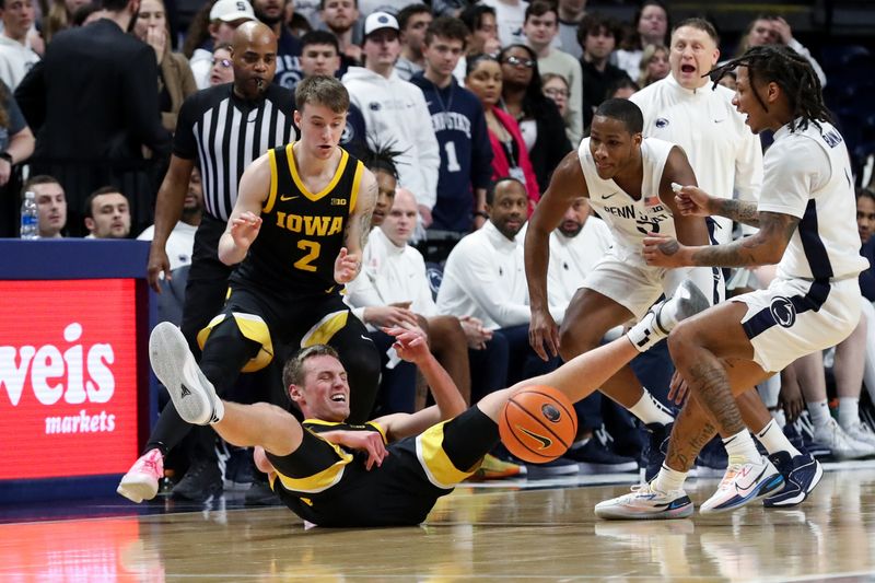 Feb 8, 2024; University Park, Pennsylvania, USA; Iowa Hawkeyes forward Payton Sandfort (20) loses control of the ball during the first half against the Penn State Nittany Lions at Bryce Jordan Center. Penn State defeated Iowa 89-79. Mandatory Credit: Matthew O'Haren-USA TODAY Sports