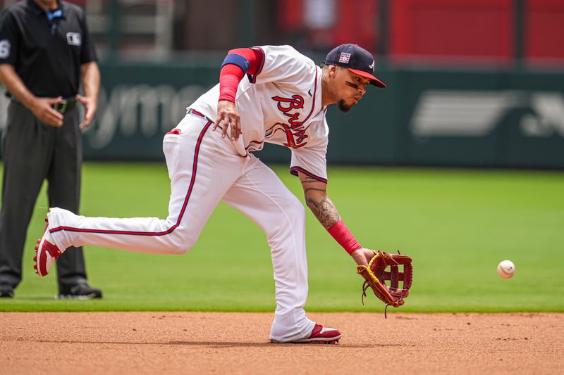 Jul 21, 2024; Cumberland, Georgia, USA; Atlanta Braves shortstop Orlando Arcia (11) field and throws out St. Louis Cardinals third baseman Nolan Arenado (28) (not pictured) during the second inning at Truist Park. Mandatory Credit: Dale Zanine-USA TODAY Sports