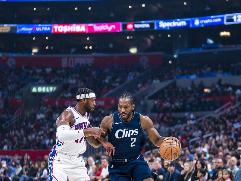 LOS ANGELES, CA - MARCH 24: Kawhi Leonard #2 of the LA Clippers drives to the basket during the game against the Philadelphia 76ers on March 24, 2024 at Crypto.Com Arena in Los Angeles, California. NOTE TO USER: User expressly acknowledges and agrees that, by downloading and/or using this Photograph, user is consenting to the terms and conditions of the Getty Images License Agreement. Mandatory Copyright Notice: Copyright 2024 NBAE (Photo by Tyler Ross/NBAE via Getty Images)