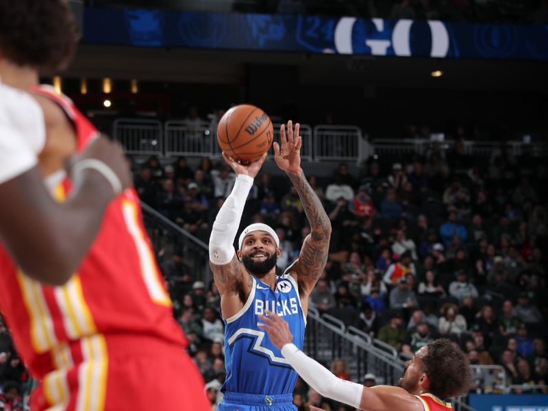 MILWAUKEE, WI - DECEMBER 4:  Gary Trent Jr. #5 of the Milwaukee Bucks shoots a three point basket during the game against the Atlanta Hawks during a regular season game on December 4, 2024 at Fiserv Forum Center in Milwaukee, Wisconsin. NOTE TO USER: User expressly acknowledges and agrees that, by downloading and or using this Photograph, user is consenting to the terms and conditions of the Getty Images License Agreement. Mandatory Copyright Notice: Copyright 2024 NBAE (Photo by Gary Dineen/NBAE via Getty Images).