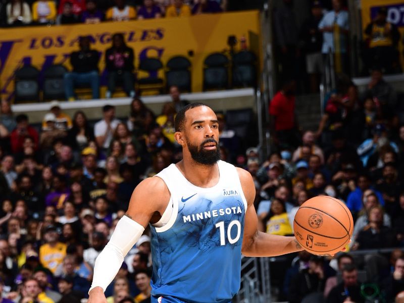 LOS ANGELES, CA - MARCH 10: Mike Conley #10 of the Minnesota Timberwolves dribbles the ball during the game against the Los Angeles Lakers on March 10, 2024 at Crypto.Com Arena in Los Angeles, California. NOTE TO USER: User expressly acknowledges and agrees that, by downloading and/or using this Photograph, user is consenting to the terms and conditions of the Getty Images License Agreement. Mandatory Copyright Notice: Copyright 2024 NBAE (Photo by Adam Pantozzi/NBAE via Getty Images)