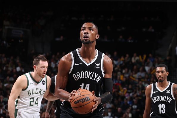 BROOKLYN, NY - DECEMBER 27: Harry Giles III #14 of the Brooklyn Nets shoots a free throw during the game against the Milwaukee Bucks on December 27, 2023 at Barclays Center in Brooklyn, New York. NOTE TO USER: User expressly acknowledges and agrees that, by downloading and or using this Photograph, user is consenting to the terms and conditions of the Getty Images License Agreement. Mandatory Copyright Notice: Copyright 2023 NBAE (Photo by Nathaniel S. Butler/NBAE via Getty Images)