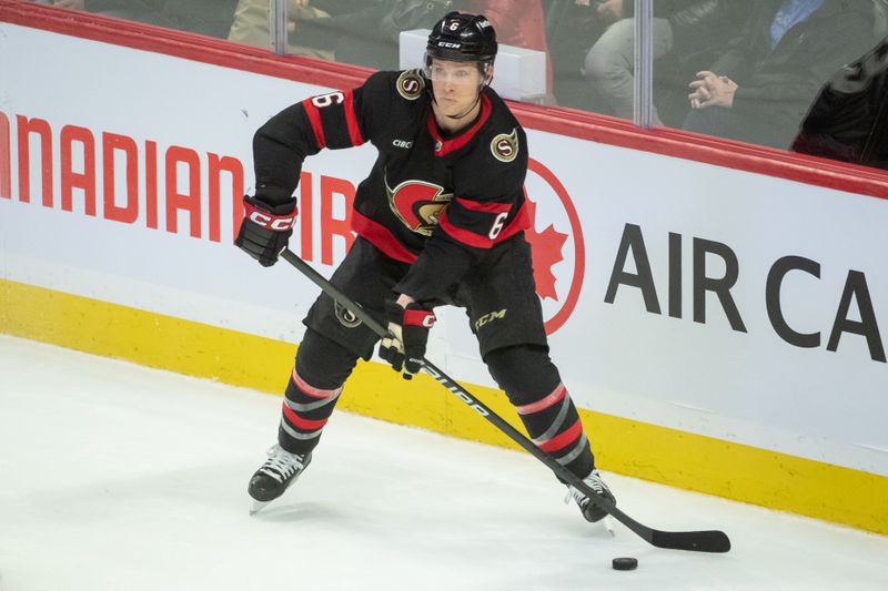 Dec 12, 2023; Ottawa, Ontario, CAN; Ottawa Senators defenseman Jakob Chychrun (6) controls the puck in the third period against the Carolina Hurricanes at the Canadian Tire Centre. Mandatory Credit: Marc DesRosiers-USA TODAY Sports.