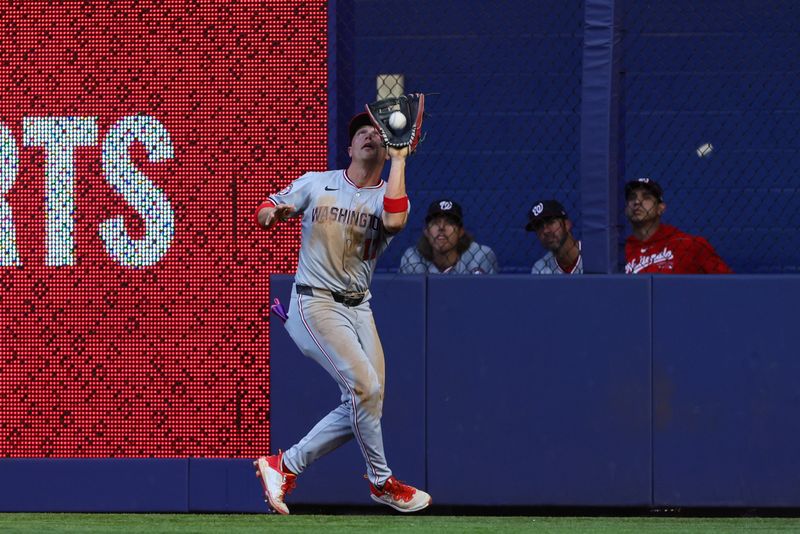 Apr 29, 2024; Miami, Florida, USA; Washington Nationals outfielder Alex Call (17) catches a fly ball against the Miami Marlins during the third inning at loanDepot Park. Mandatory Credit: Sam Navarro-USA TODAY Sports