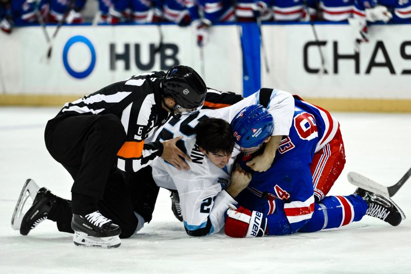 Oct 12, 2024; New York, New York, USA; Utah Hockey Club center Jack McBain (22) and New York Rangers center Adam Edstrom (84) have a physical confrontation during the second period at Madison Square Garden. Mandatory Credit: John Jones-Imagn Images