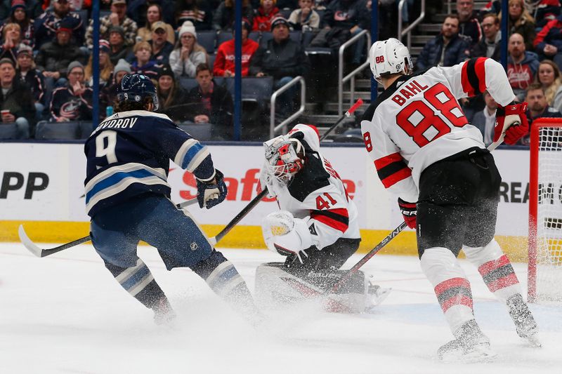 Jan 19, 2024; Columbus, Ohio, USA; New Jersey Devils goalie Vitek Vanecek (41) makes a save as Columbus Blue Jackets defenseman Ivan Provorov (9) looks for a rebound during the first period at Nationwide Arena. Mandatory Credit: Russell LaBounty-USA TODAY Sports