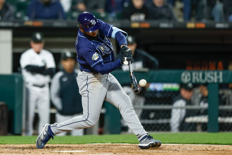 Apr 28, 2023; Chicago, Illinois, USA; Tampa Bay Rays center fielder Manuel Margot (13) doubles against the Chicago White Sox during the seventh inning at Guaranteed Rate Field. Mandatory Credit: Kamil Krzaczynski-USA TODAY Sports