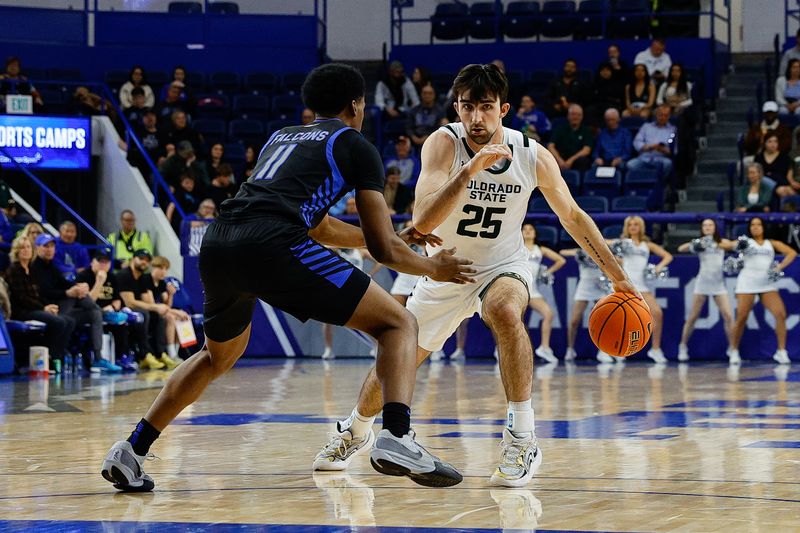 Feb 25, 2025; Colorado Springs, Colorado, USA; Colorado State Rams guard Ethan Morton (25) controls the ball against Air Force Falcons guard Byron Brown (11) in the second half at Clune Arena. Mandatory Credit: Isaiah J. Downing-Imagn Images