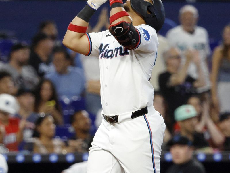 Aug 6, 2025; Miami, Florida, USA;  Miami Marlins right fielder Heriberto Hernandez (64) watches reacts to his home run against the Houston Astros during the third inning at loanDepot Park. Mandatory Credit: Rhona Wise-Imagn Images
