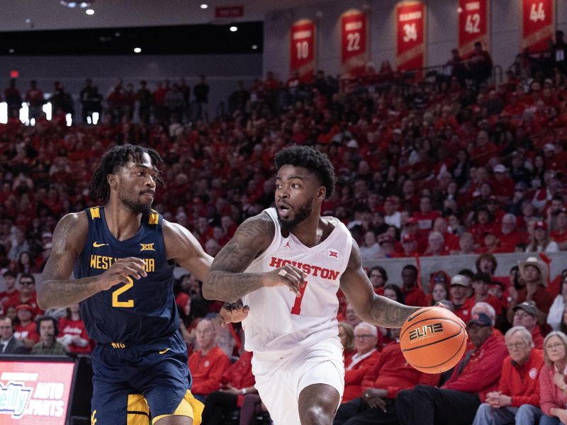 Jan 6, 2024; Houston, Texas, USA; Houston Cougars guard Jamal Shead (1) dribbles against West Virginia Mountaineers guard Kobe Johnson (2) in the second half at Fertitta Center. Mandatory Credit: Thomas Shea-USA TODAY Sports