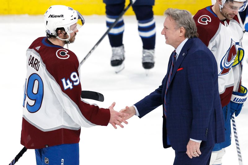 Apr 30, 2024; Winnipeg, Manitoba, CAN; Winnipeg Jets head coach Rick Bowness congratulates Colorado Avalanche defenseman Samuel Girard (49) in game five of the first round of the 2024 Stanley Cup Playoffs at Canada Life Centre. Mandatory Credit: James Carey Lauder-USA TODAY Sports