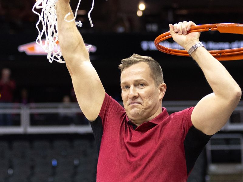 Mar 16, 2024; Kansas City, MO, USA; Iowa State Cyclones coach TJ Otzelberger holds up the net after the game against the Houston Cougars T-Mobile Center. Mandatory Credit: William Purnell-USA TODAY Sports