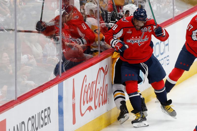 Nov 8, 2024; Washington, District of Columbia, USA; Washington Capitals left wing Alex Ovechkin (8) checks Pittsburgh Penguins center Sidney Crosby (87) in the first period at Capital One Arena. Mandatory Credit: Geoff Burke-Imagn Images