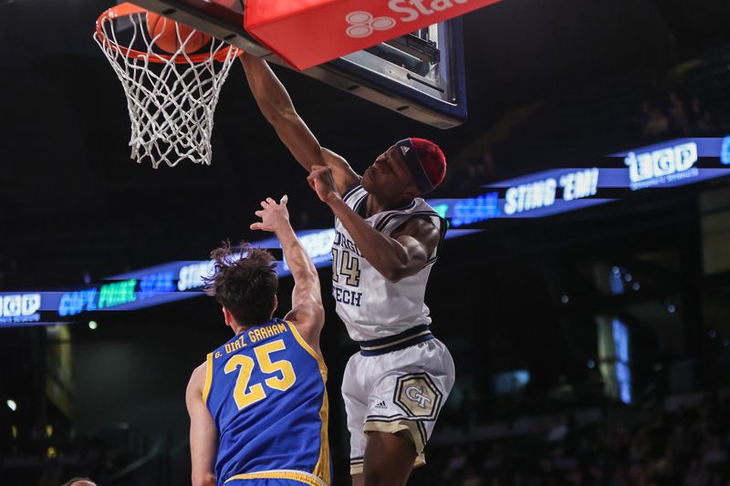 Jan 23, 2024; Atlanta, Georgia, USA; Georgia Tech Yellow Jackets guard Kowacie Reeves Jr. (14) dunks past Pittsburgh Panthers forward Guillermo Diaz Graham (25) in the second half at McCamish Pavilion. Mandatory Credit: Brett Davis-USA TODAY Sports
