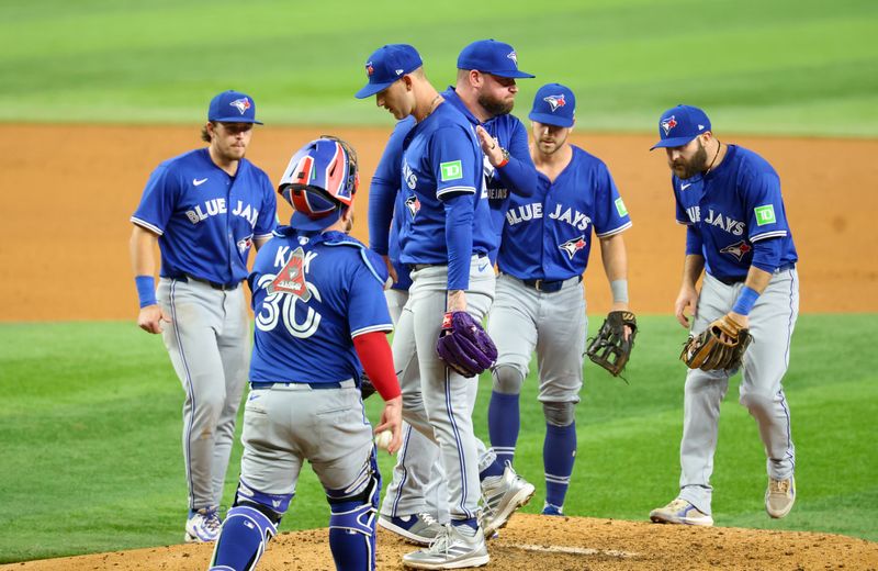 May 27, 2025; Arlington, Texas, USA; Toronto Blue Jays manager John Schneider (14) removes Toronto Blue Jays starting pitcher Bowden Francis (44) during the sixth inning against the Texas Rangers at Globe Life Field. Mandatory Credit: Kevin Jairaj-Imagn Images