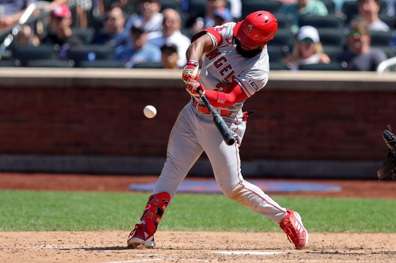 Aug 27, 2023; New York City, New York, USA; Los Angeles Angels second baseman Luis Rengifo (2) hits a solo home run against the New York Mets during the eighth inning at Citi Field. Mandatory Credit: Brad Penner-USA TODAY Sports