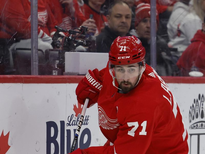 Feb 29, 2024; Detroit, Michigan, USA;  Detroit Red Wings center Dylan Larkin (71) skates with the puck in the second period against the New York Islanders at Little Caesars Arena. Mandatory Credit: Rick Osentoski-USA TODAY Sports