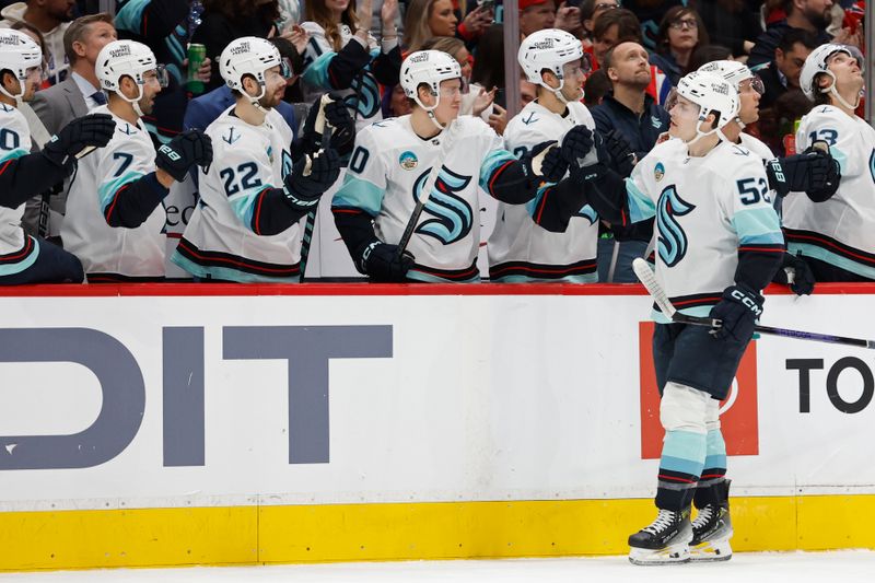 Jan 11, 2024; Washington, District of Columbia, USA; Seattle Kraken left wing Tye Kartye (52) celebrates with teammates after scoring a goal against the Washington Capitals in the first period at Capital One Arena. Mandatory Credit: Geoff Burke-USA TODAY Sports