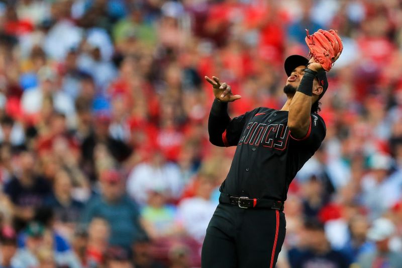 Jun 21, 2024; Cincinnati, Ohio, USA; Cincinnati Reds third baseman Santiago Espinal (4) catches a pop up hit by Boston Red Sox catcher Connor Wong (not pictured) in the fourth inning at Great American Ball Park. Mandatory Credit: Katie Stratman-USA TODAY Sports