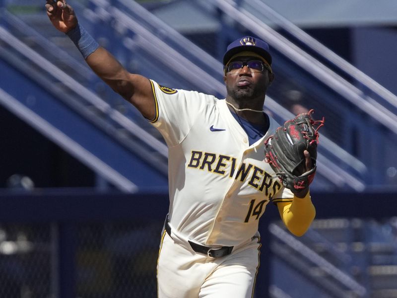 Mar 13, 2024; Phoenix, Arizona, USA; Milwaukee Brewers shortstop Andrew Monasterio (14) makes the play against the Chicago White Sox in the third inning at American Family Fields of Phoenix. Mandatory Credit: Rick Scuteri-USA TODAY Sports