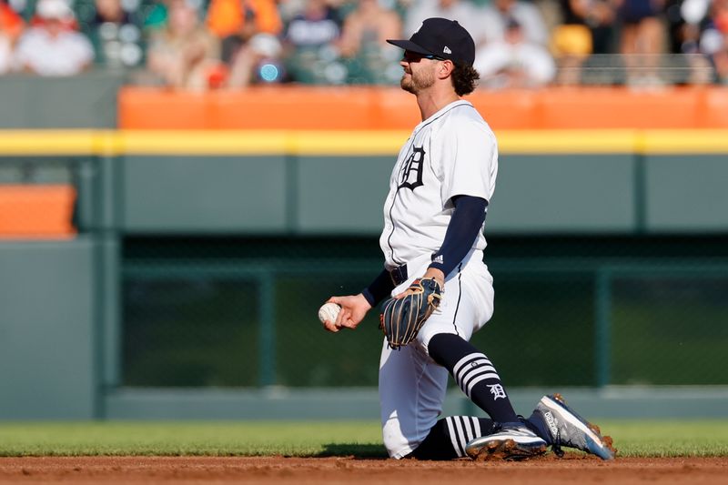 Jun 24, 2024; Detroit, Michigan, USA;  Detroit Tigers shortstop Zach McKinstry (39) reacts after committing an error in the first inning against the Philadelphia Phillies at Comerica Park. Mandatory Credit: Rick Osentoski-USA TODAY Sports