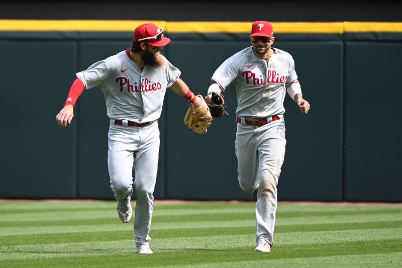 Apr 19, 2023; Chicago, Illinois, USA; Philadelphia Phillies center fielder Brandon Marsh (16) celebrates with Phillies right fielder Nick Castellanos (8) after catching a fly ball hit by Chicago White Sox first baseman Andrew Vaughn (not pictured) during the sixth inning at Guaranteed Rate Field. Mandatory Credit: Matt Marton-USA TODAY Sports