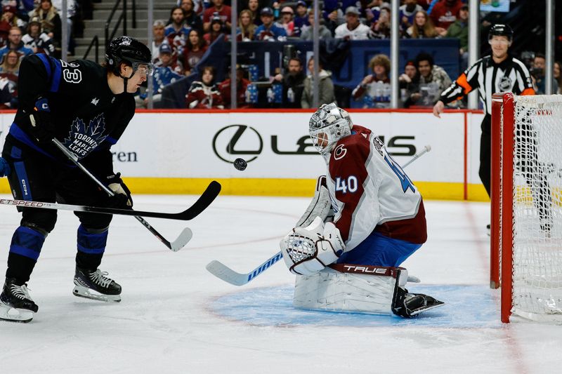 Feb 24, 2024; Denver, Colorado, USA; Colorado Avalanche goaltender Alexandar Georgiev (40) makes a save against Toronto Maple Leafs left wing Matthew Knies (23) in the first period at Ball Arena. Mandatory Credit: Isaiah J. Downing-USA TODAY Sports