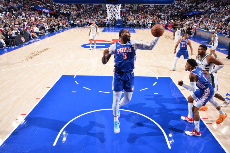 PHILADELPHIA, PA - OCTOBER 23: Andre Drummond #5 of the Philadelphia 76ers rebounds the ball during the game against the Milwaukee Bucks on October 23, 2024 at the Wells Fargo Center in Philadelphia, Pennsylvania NOTE TO USER: User expressly acknowledges and agrees that, by downloading and/or using this Photograph, user is consenting to the terms and conditions of the Getty Images License Agreement. Mandatory Copyright Notice: Copyright 2024 NBAE (Photo by Jesse D. Garrabrant/NBAE via Getty Images)