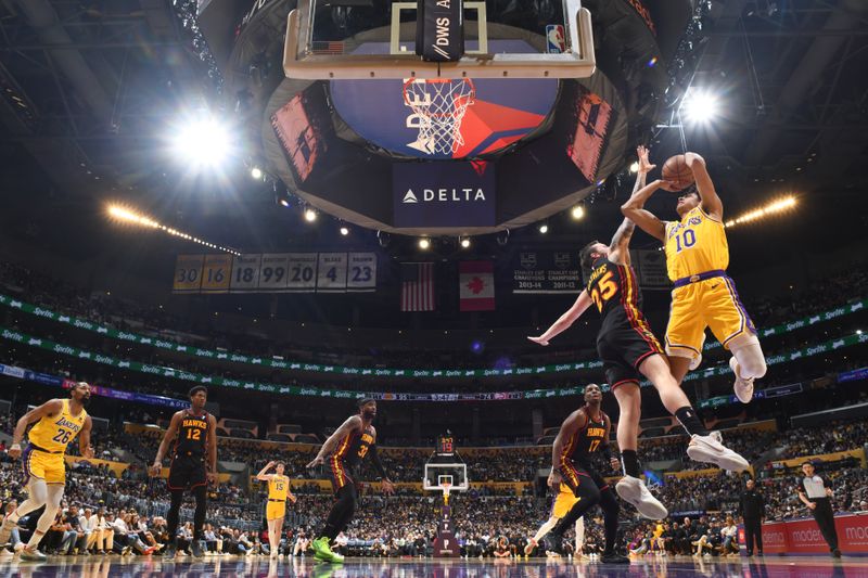 LOS ANGELES, CA - MARCH 18:  Max Christie #10 of the Los Angeles Lakers goes to the basket during the game on March 18, 2024 at Crypto.Com Arena in Los Angeles, California. NOTE TO USER: User expressly acknowledges and agrees that, by downloading and/or using this Photograph, user is consenting to the terms and conditions of the Getty Images License Agreement. Mandatory Copyright Notice: Copyright 2024 NBAE (Photo by Adam Pantozzi/NBAE via Getty Images)