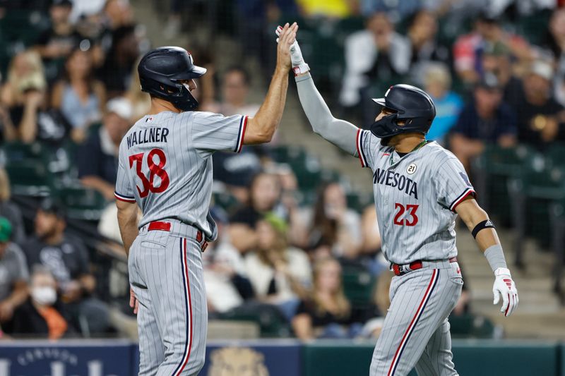 Sep 15, 2023; Chicago, Illinois, USA; Minnesota Twins third baseman Royce Lewis (23) celebrates with right fielder Matt Wallner (38) after hitting a grand slam against the Chicago White Sox during the second inning at Guaranteed Rate Field. Mandatory Credit: Kamil Krzaczynski-USA TODAY Sports